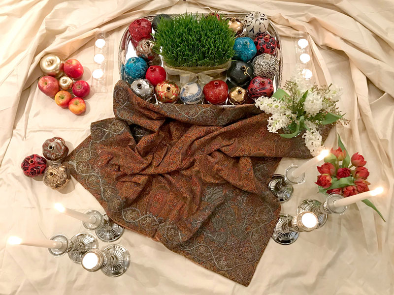 small sofreh with ceramic pomegranates