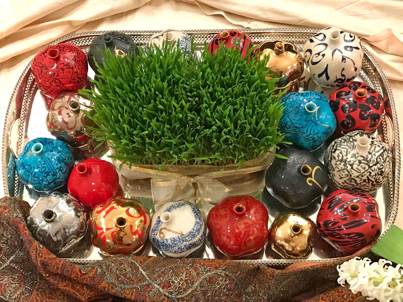 compact sofreh with ceramic pomegranates