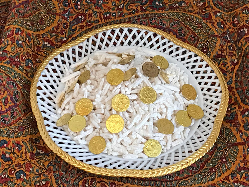 sugared almonds speckled with gilded coins