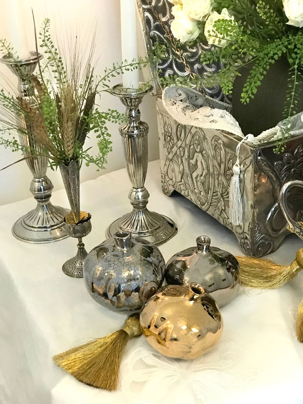 shiny gold-and silver-finish ceramic pomegranates