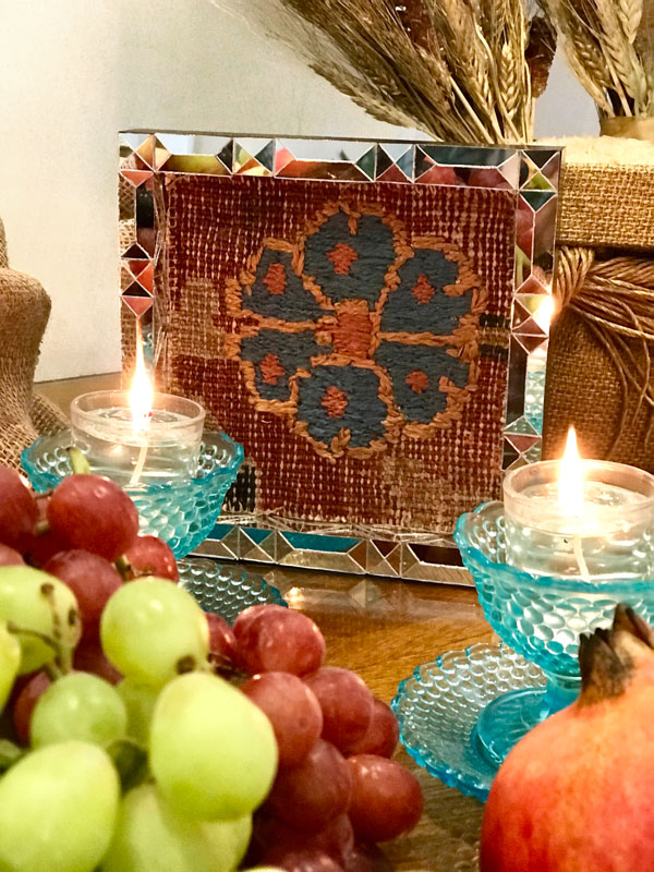 fragment of worn Persian carpet with the classic Persian art