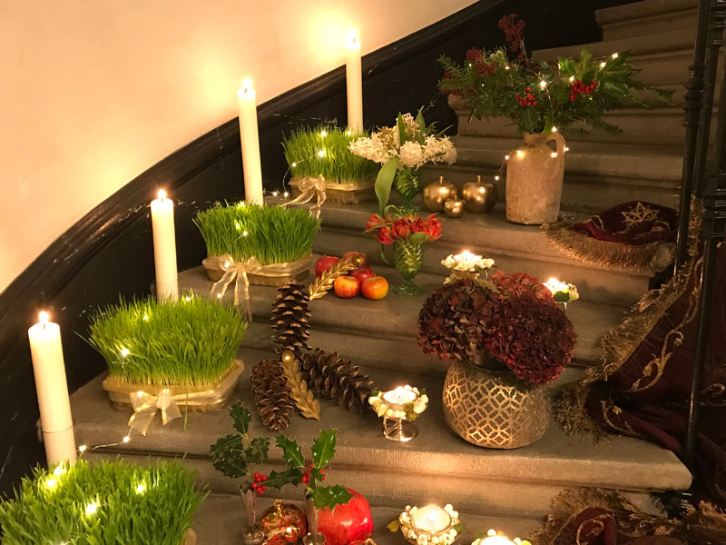 holly, pine, tealights, and candles