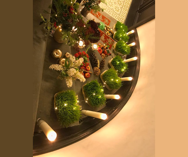 seven level Christmas Sofreh with holly and candles