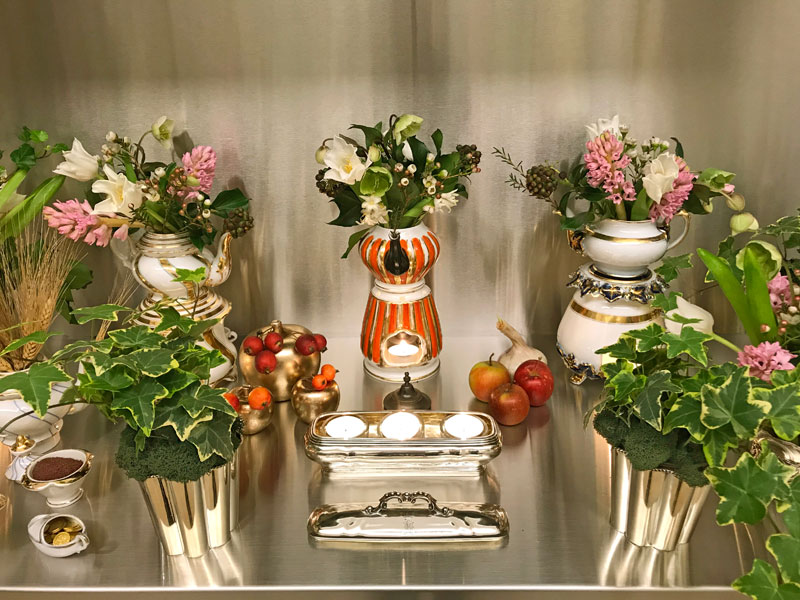 bouquets of tulips, hyacinths, hellebores, and berried ivy