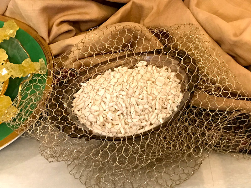 sugared almonds in antique bronze container