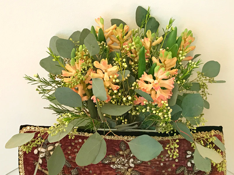 peach hyacinths, wax flowers and seeded Eucalyptus