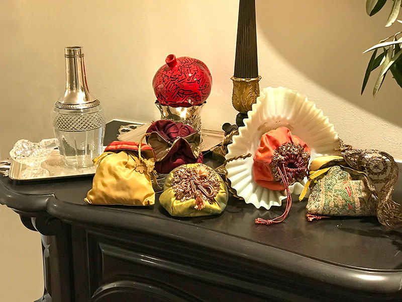 antique silver and crystal flask of rosewater, pomegranate, bonbonnieres