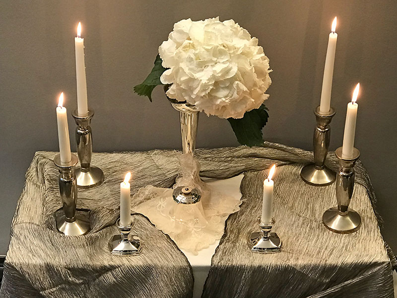 Snowball hydrangea and candles on silk