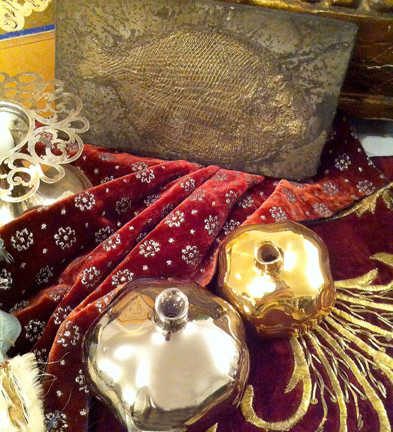 plaque with fossilized fish, gold and silver pomegranates