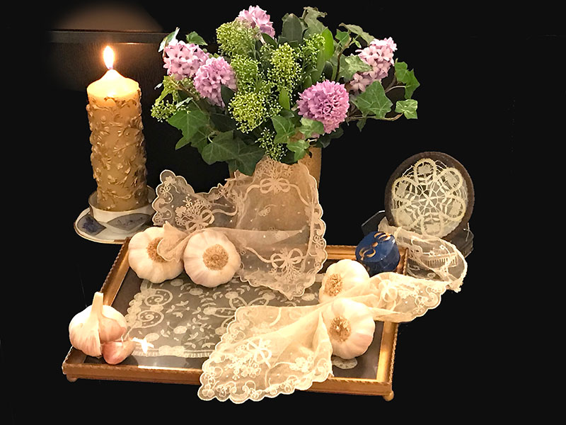 lace, candles, hyacinths, ivy, garlic bulbs