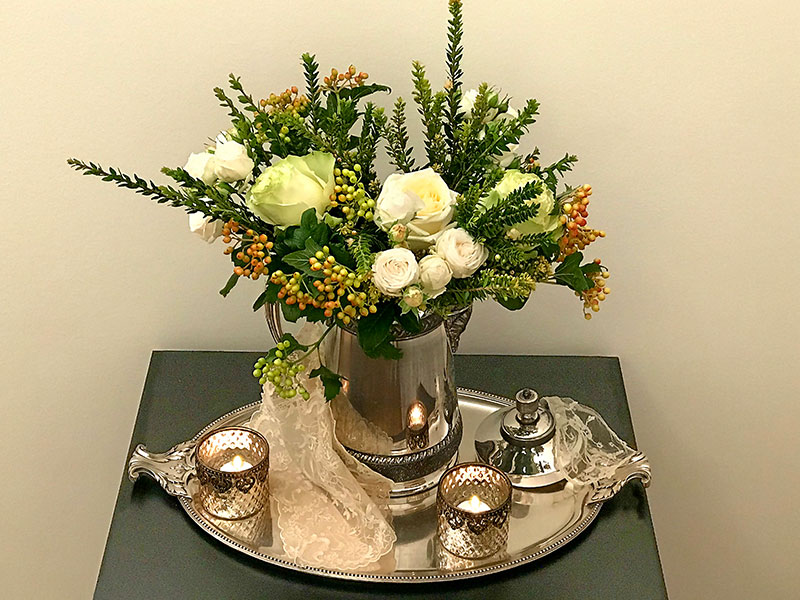 flowers on silver plated tray