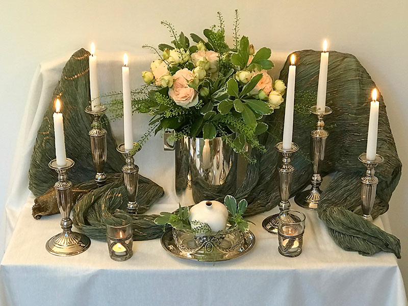 bouquet of Lorena Summerhouse roses, pomegranate, and candles