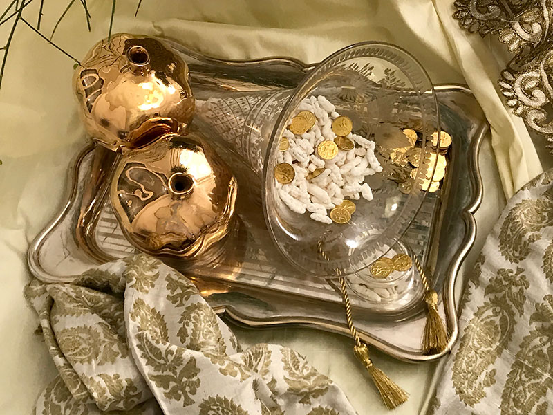 glazed gold ceramic pomegranates, cone vessel with almonds