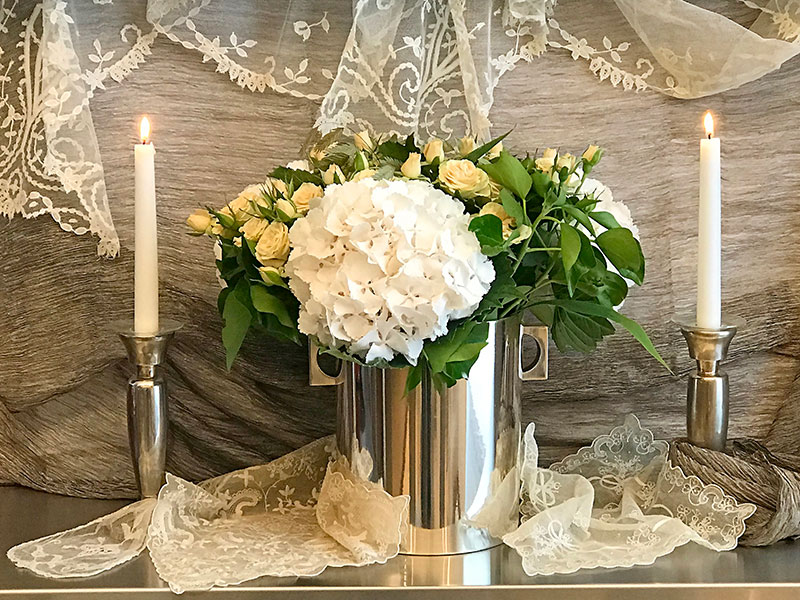 flower arrangement on stainless steel with silver textile