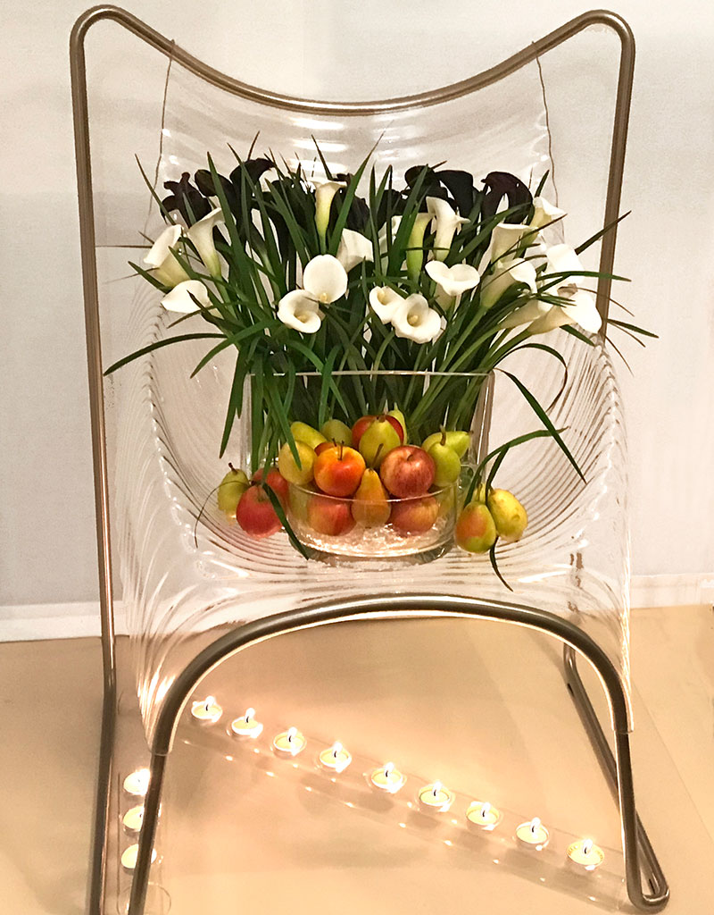 sofreh on chair with lilies and foliage and tea lights