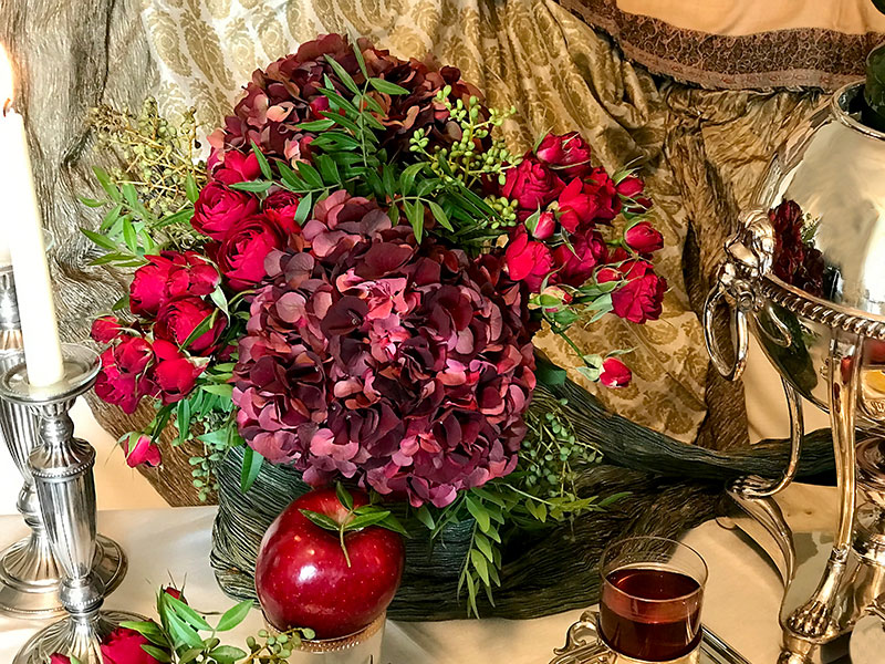 deep-red hydrangeas and red apple in this sofreh