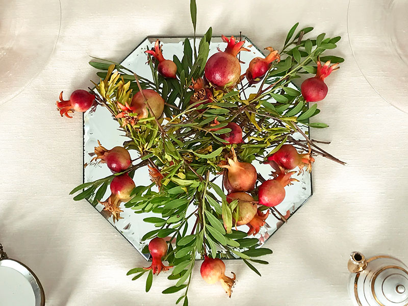 pomegranate on a Venetian-style cut glass mirror