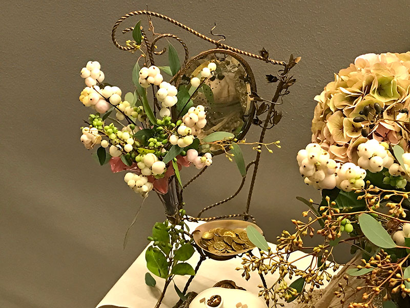 snowberries, foliage, antique mirror, gilded coins