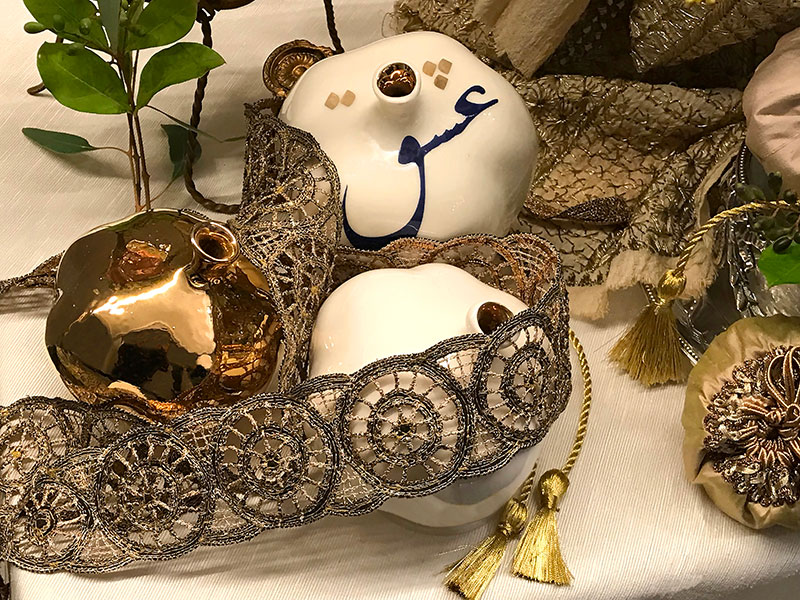 ceramic pomegranates on decorative trim