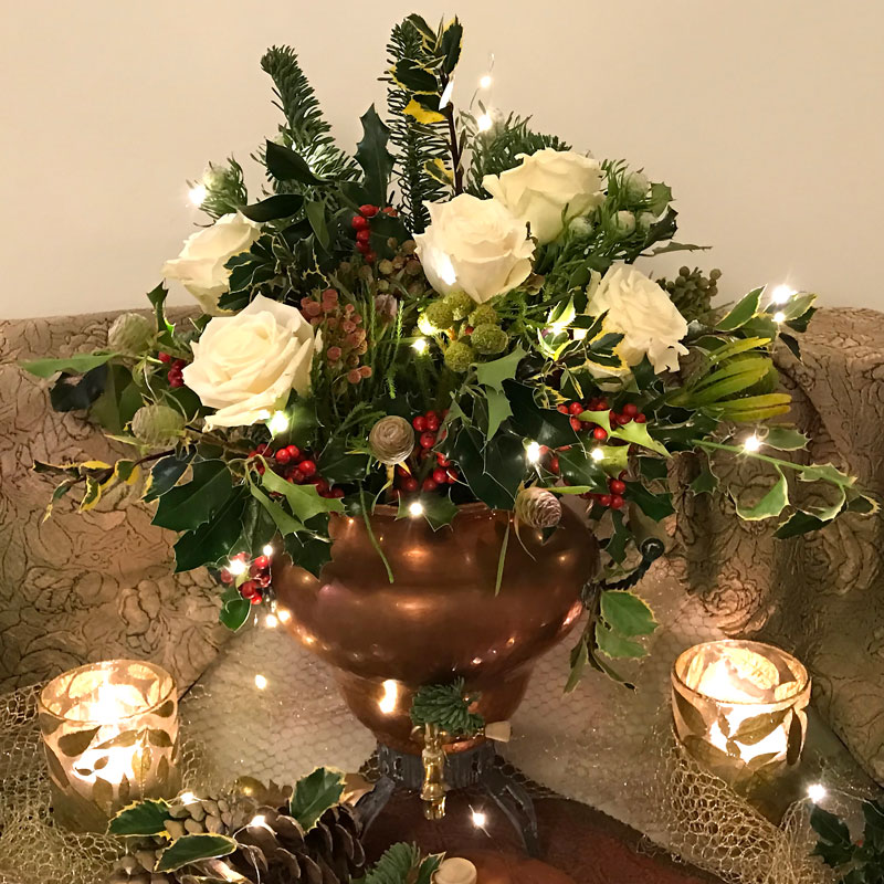 Christmas foliage embellished with miniature Christmas lights.