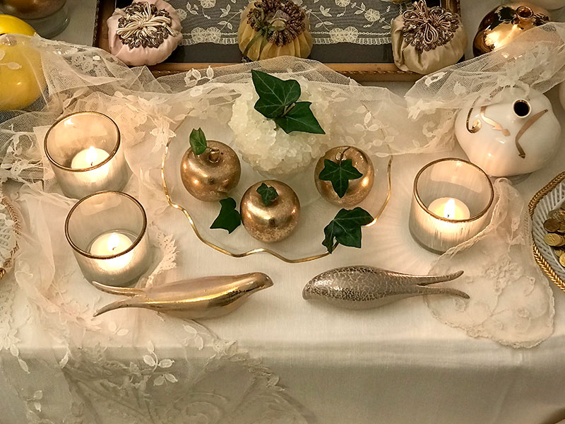 tea lights, gold apples, ceramic birds