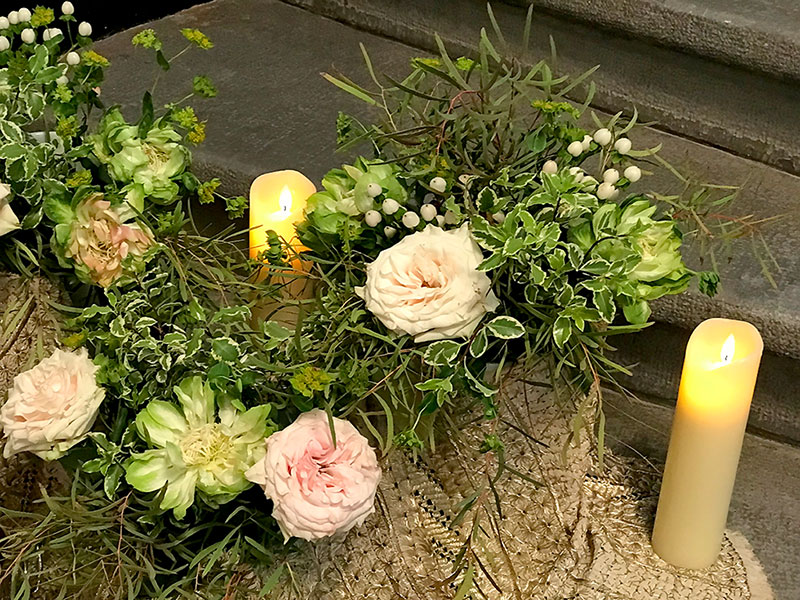 two candles, and flowers