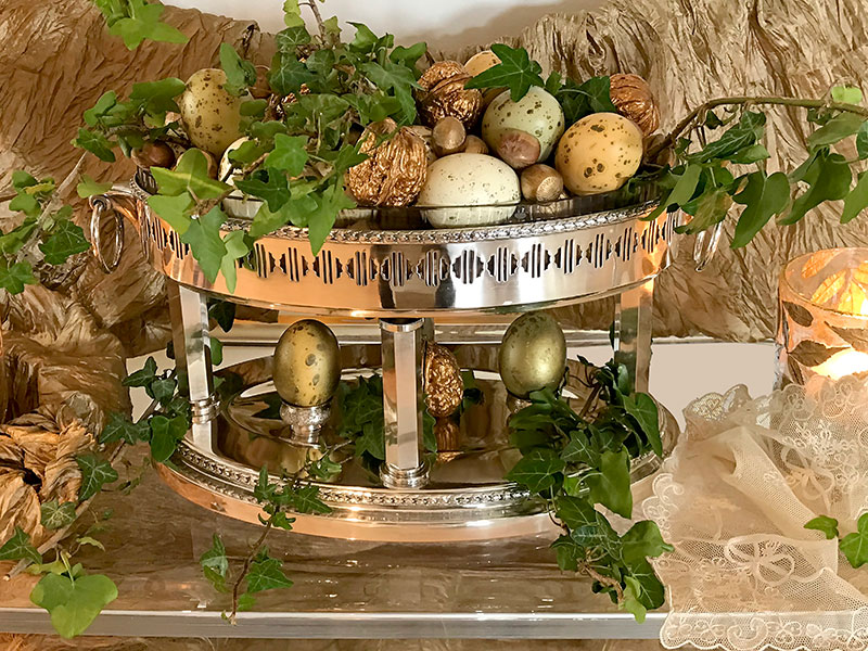 silver vessel with decorated eggs and nuts