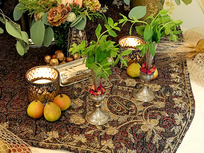 termeh, silver vases, herbs, roses