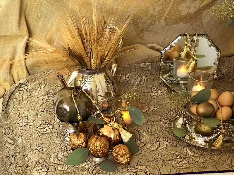 Sheaves of wheat and an antique silver-plated teapot.