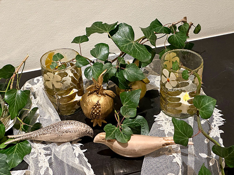 ceramic birds, gold pomegranates, antique lace and ivy