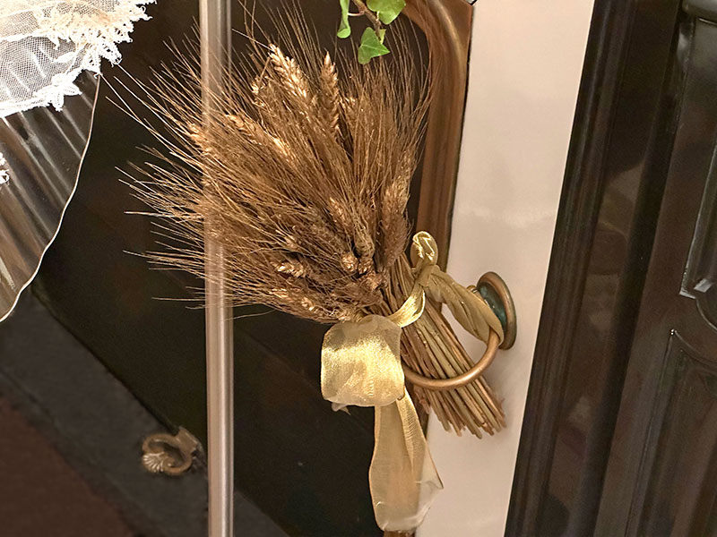 sheaves of wheat with gold ribbon