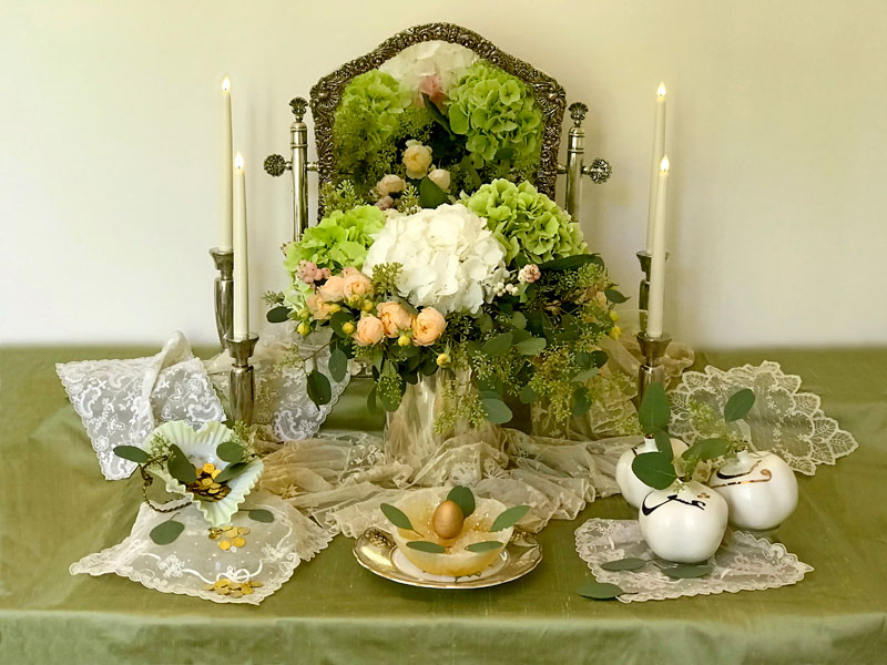 overall view inspired by the juxtaposition of a bouquet of pastel hydrangeas, roses and foliage, and fine antique lace