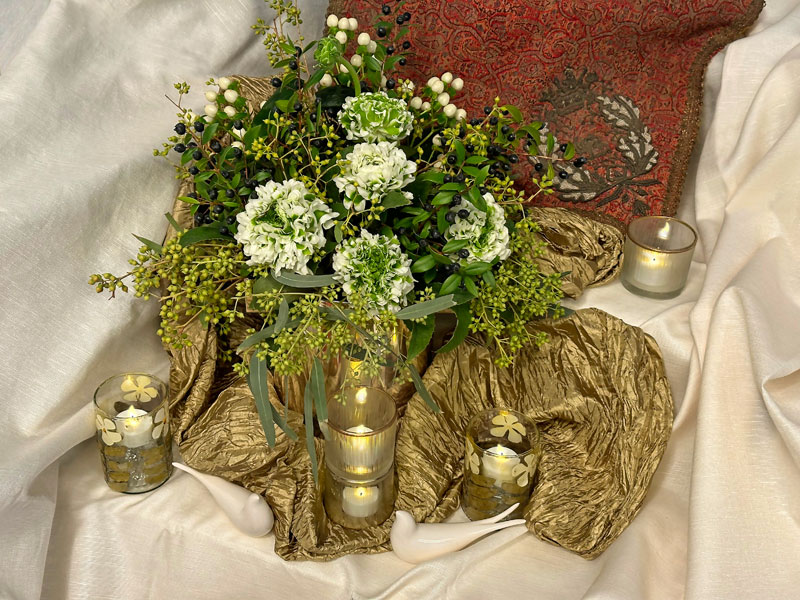 A splendid bouquet of Pompon Igloo ranunculi, Coco Uno Hypericums, Eucalyptus exotica and Myrtus