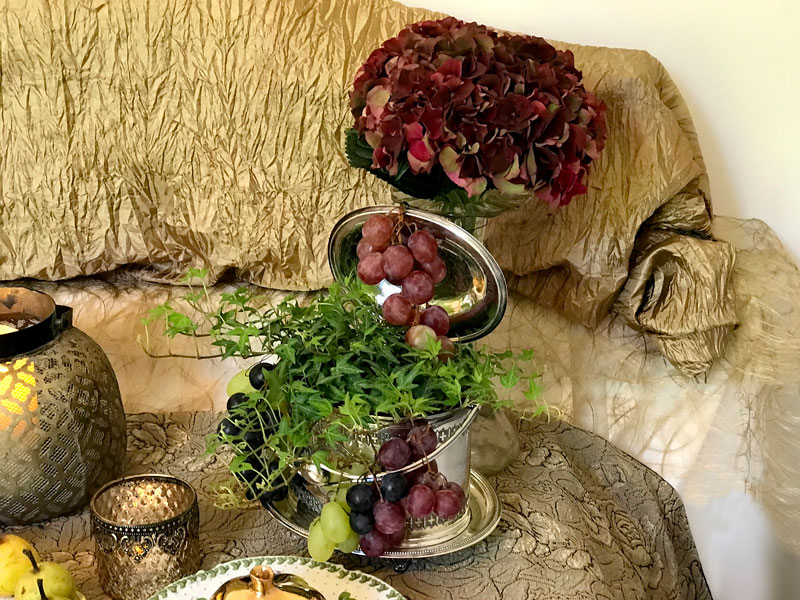 An antique silver-plated biscuit barrel holds a delightful type of trailing ivy with delicate leaves