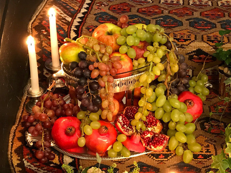 display of colourful autumnal fruits, showcased in an elegant two-tiered antique silver-plated and crystal vessel and on an antique silver-plated tray