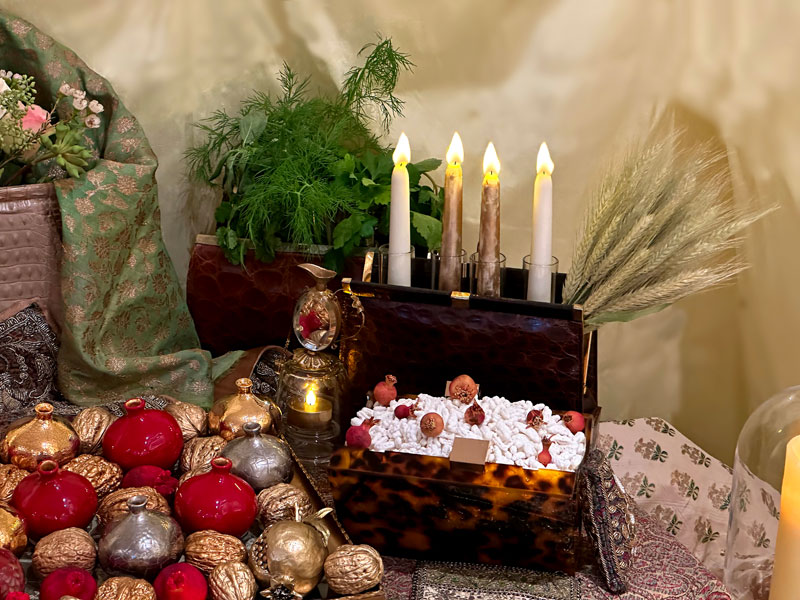 vintage handbag houses candles and a sheaf of wheat