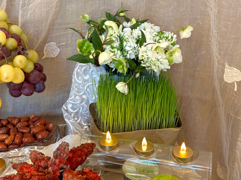 bouquets made of ivory and green Pompon Igloo ranunculi and Helleborus niger