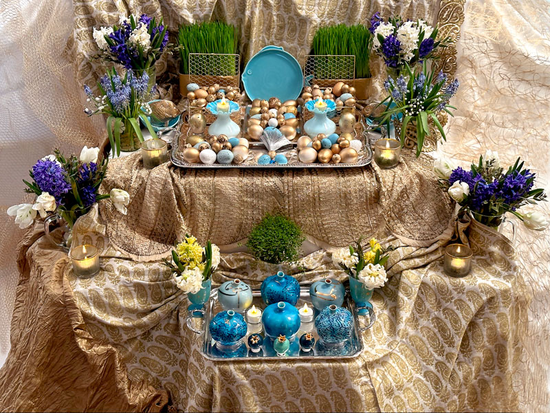 A ceramic blue dish in the form of a fish, together with an impressive platter of decorated eggs