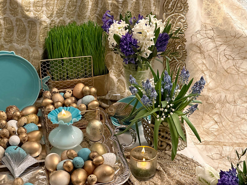 two bouquets of spring flowers, namely white and striking blue hyacinths mixed with foliage
