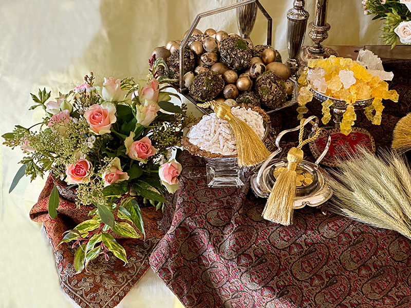 baskets of decorated eggs, gilded coins, almonds, crystal sugar, and foliage