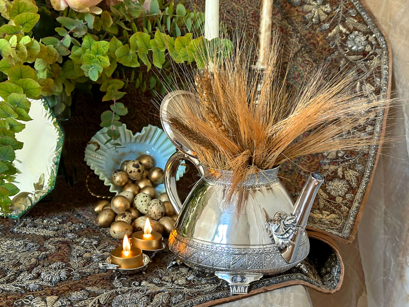 gold-tinted wheat are presented in an attractive antique silver-plated teapot